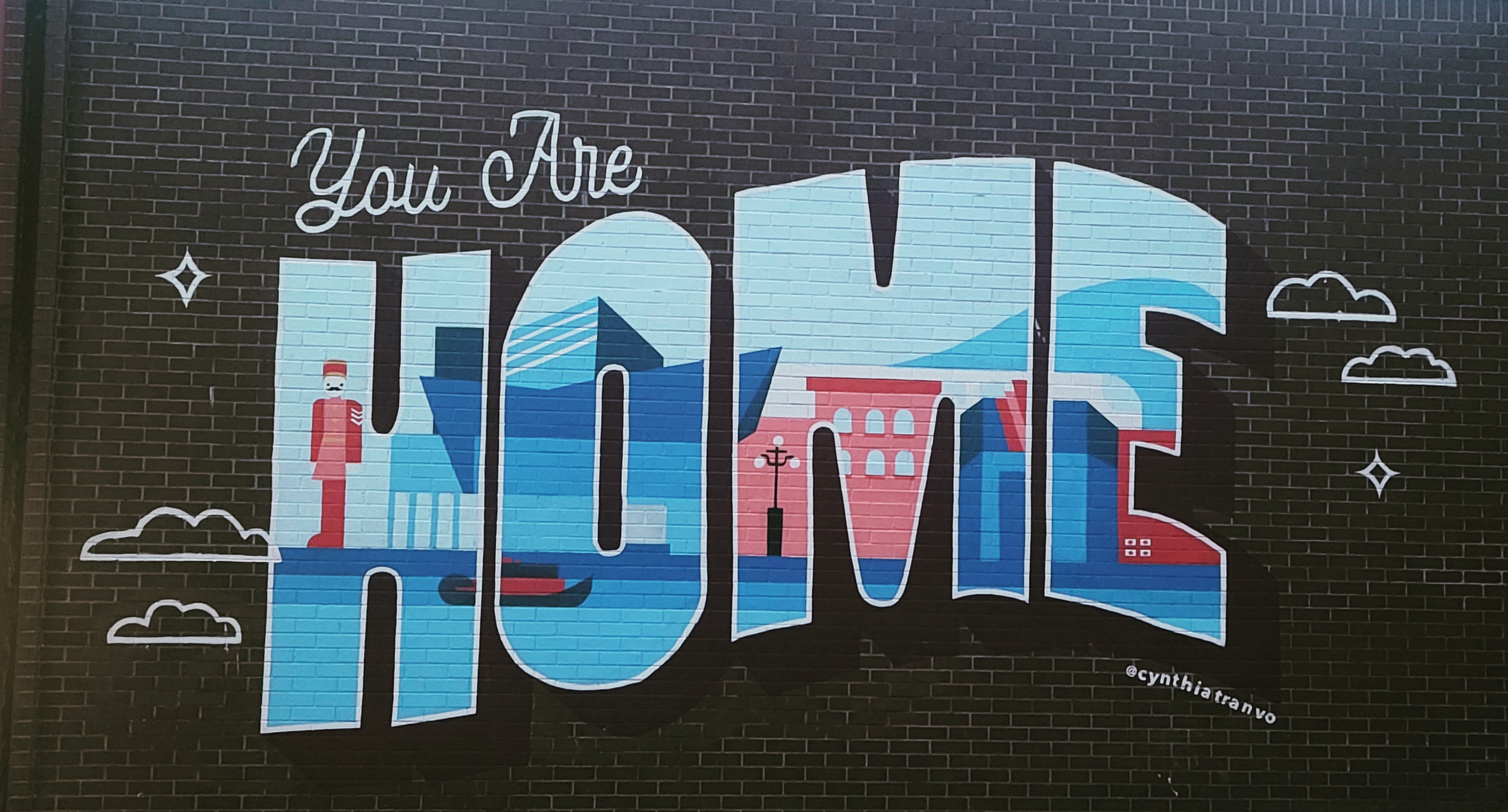 Colourful Mural on Wall: Welcome Home